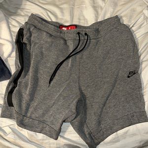 Gray Nike athletic tech fleece shorts